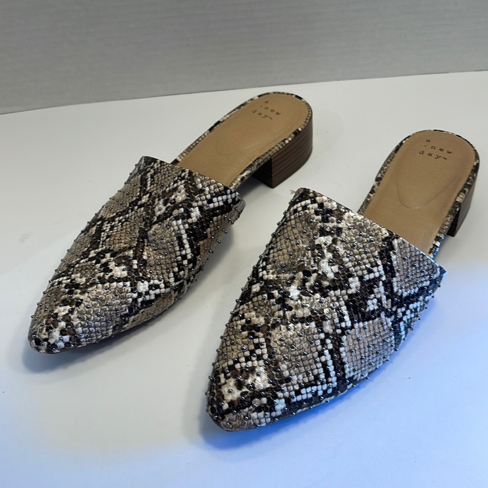 Women’s snakeskin mules size 10 gently used.